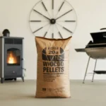 A 20lb bag of wood pellets centered between a pellet stove and a pellet grill, illustrating how long the pellets last for heating and cooking.